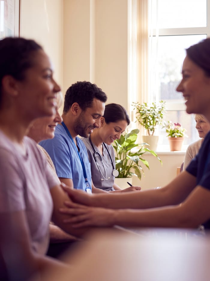 A healthcare worker caring for a patient